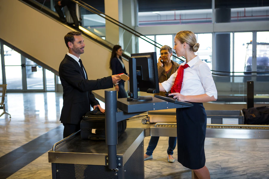 female staff interacting with passenger