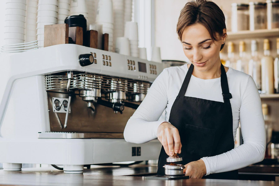 woman barista coffee shop preparing coffee